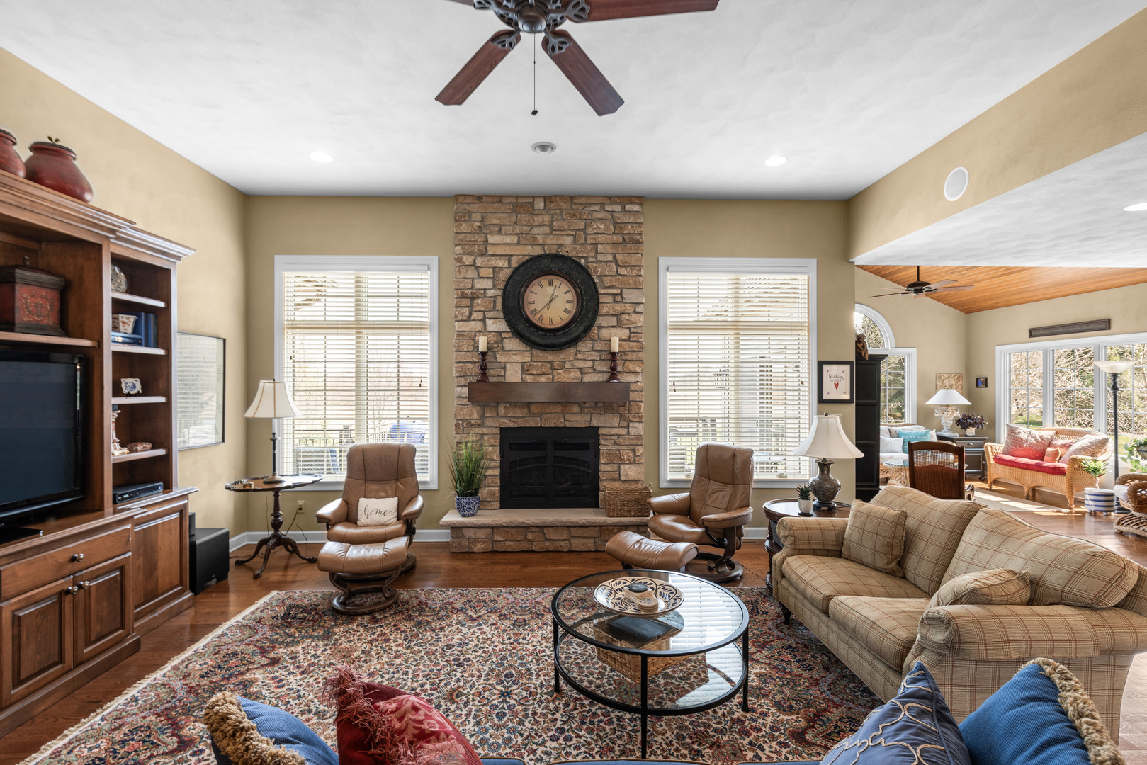 10125 Creek Ridge Trail Belvidere, IL 61008 - Photo 12 of 41 a living room with furniture a fireplace and a flat screen tv