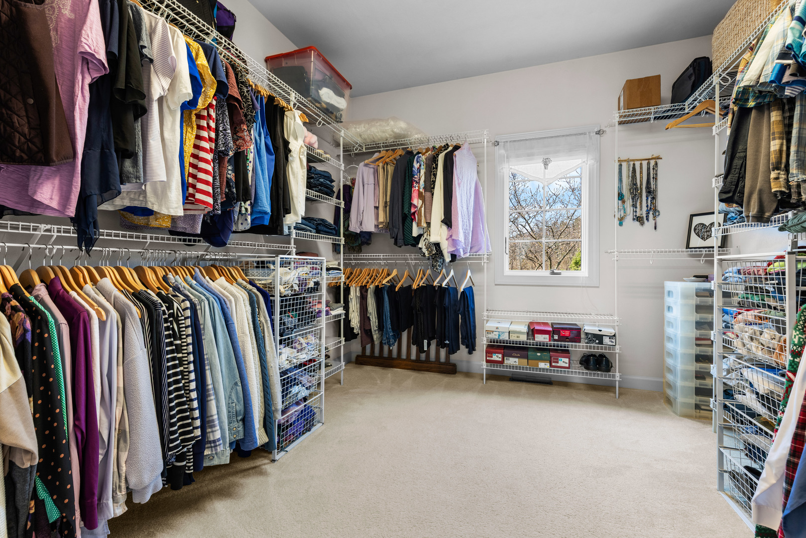 10125 Creek Ridge Trail Belvidere, IL 61008 - Photo 18 of 41 a view of walk in closet with clothes and shoes
