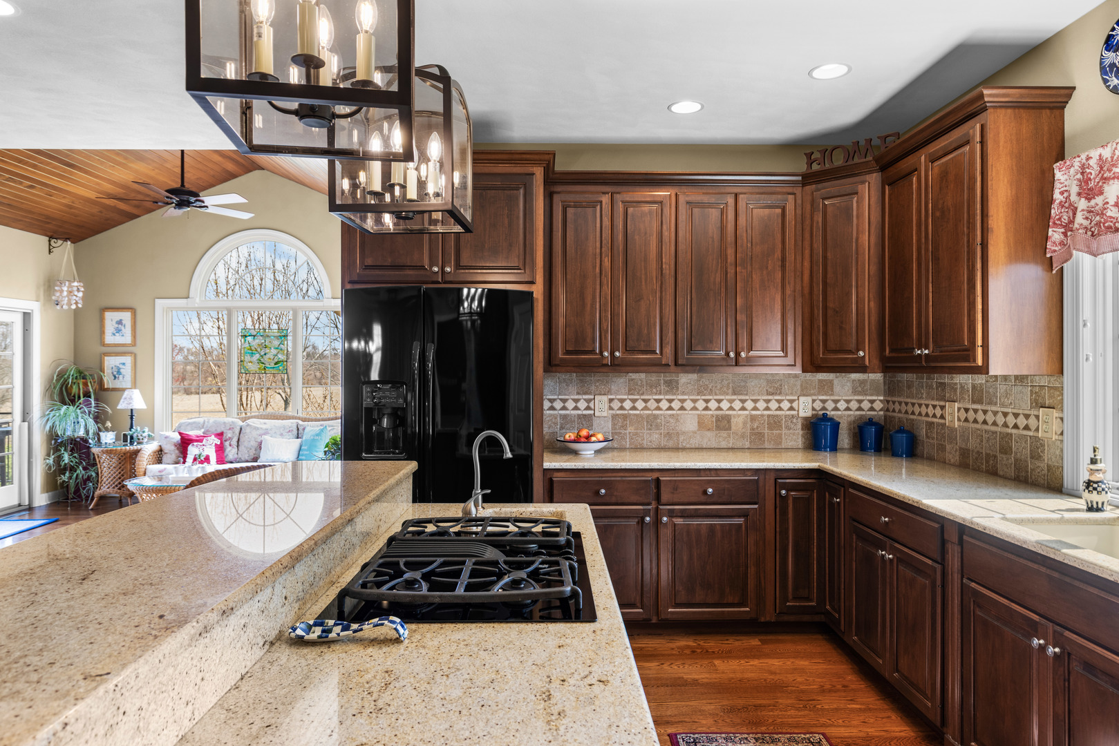10125 Creek Ridge Trail Belvidere, IL 61008 - Photo 2 of 41 a kitchen with a large stove a sink dishwasher and cabinets with wooden floor