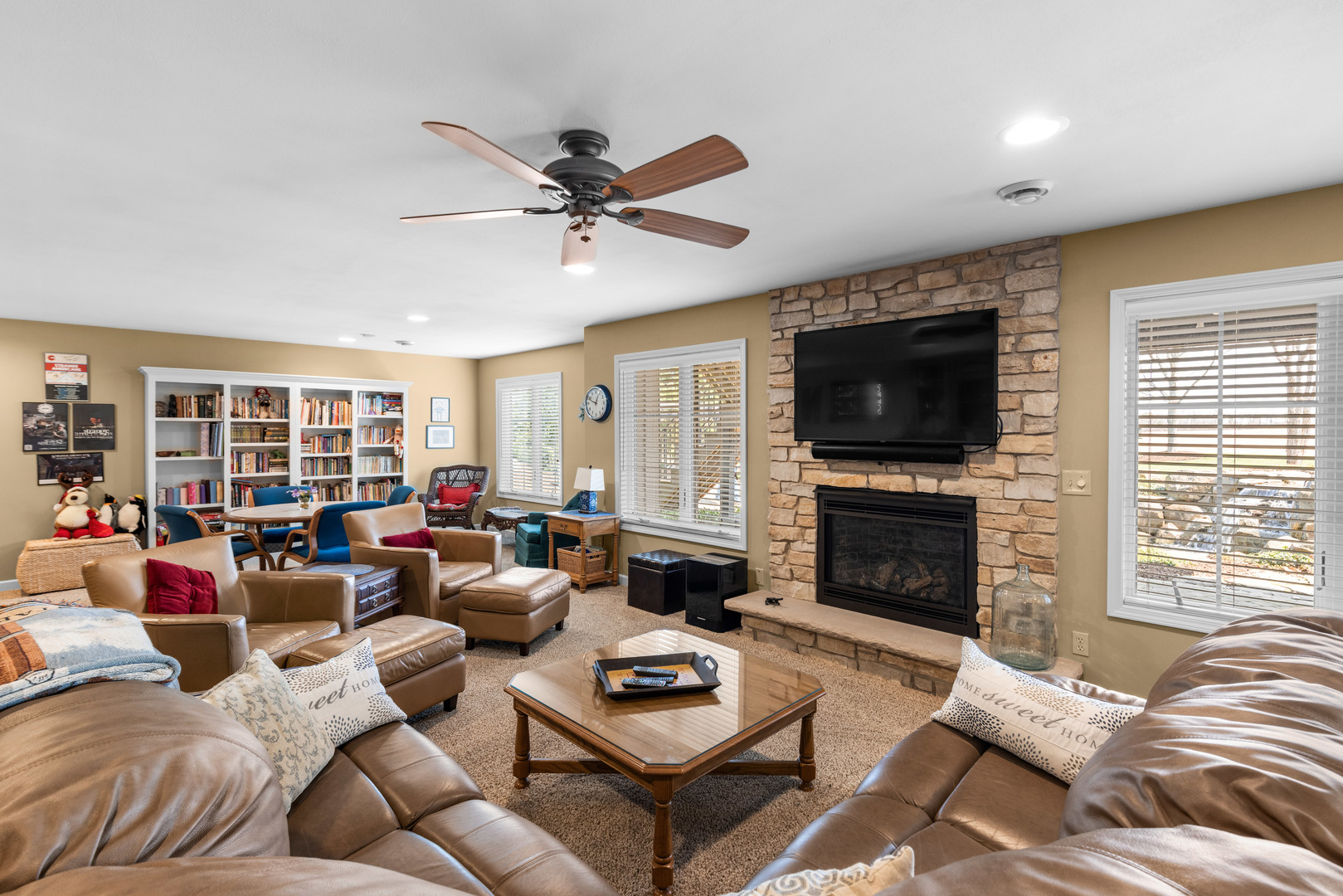 10125 Creek Ridge Trail Belvidere, IL 61008 - Photo 27 of 41 a living room with furniture a flat screen tv and a fireplace