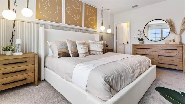 a bedroom with a bed and a dresser