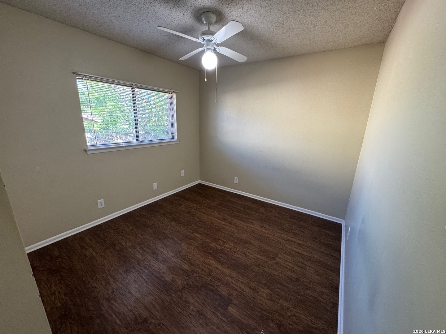 7236 Rimwood Street San Antonio, TX 78233 - Photo 13 of 16 an empty room with a window and a fan
