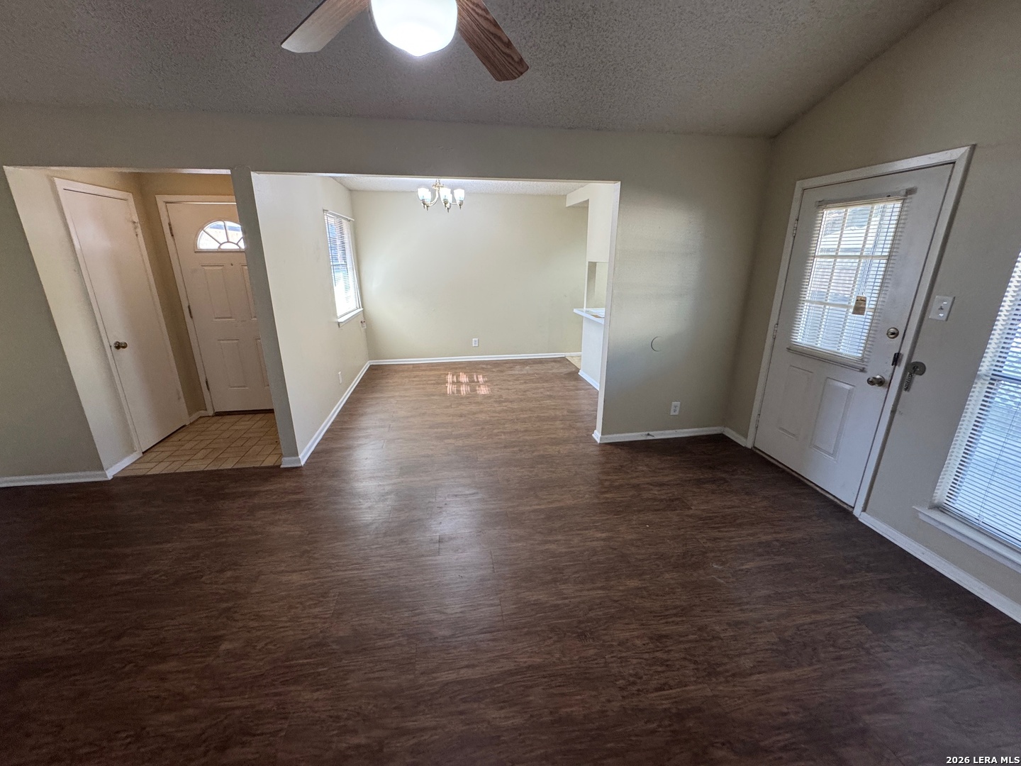 7236 Rimwood Street San Antonio, TX 78233 - Photo 6 of 16 an empty room with wooden floor and windows