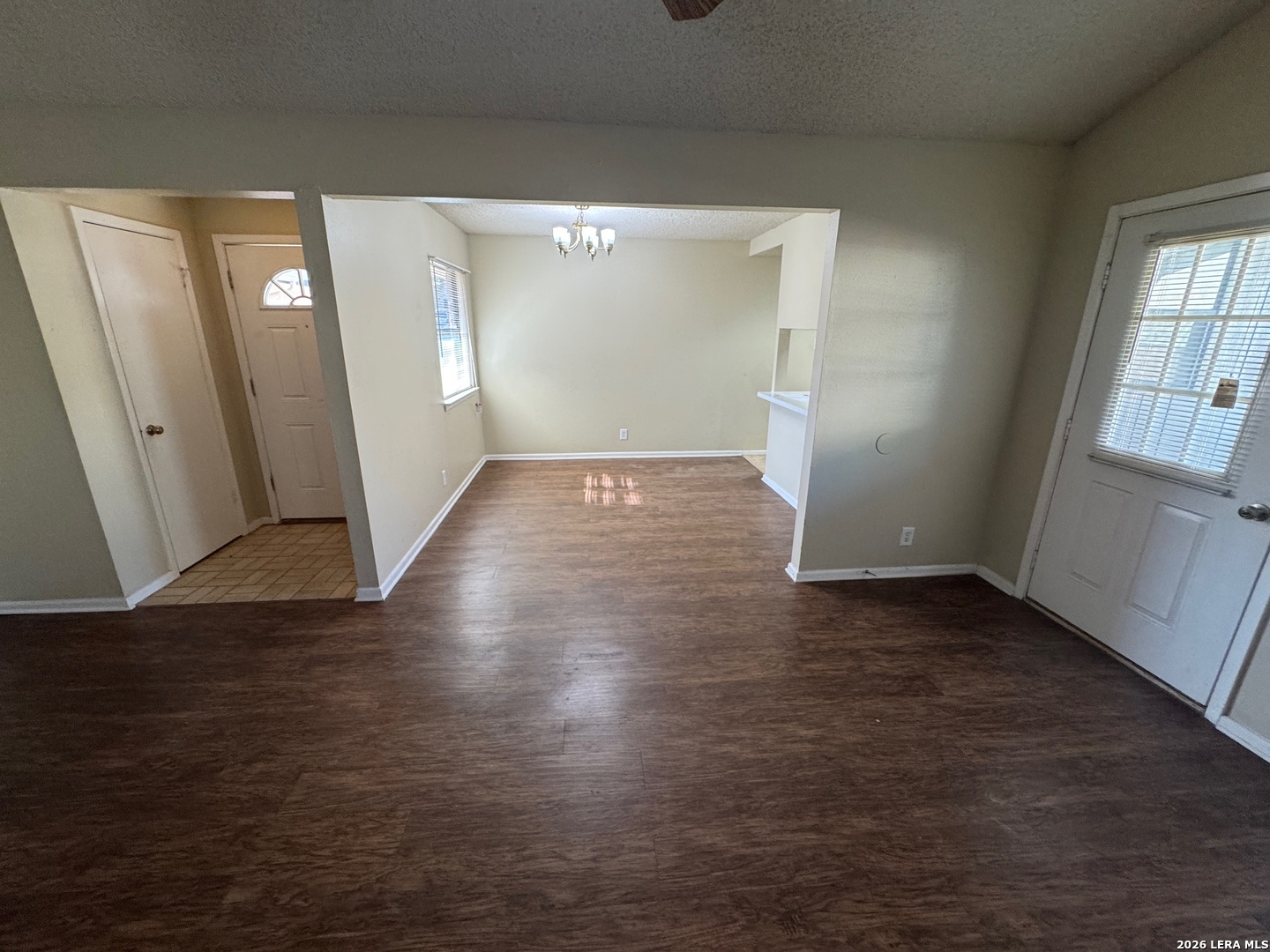 7236 Rimwood Street San Antonio, TX 78233 - Photo 7 of 16 an empty room with wooden floor and windows