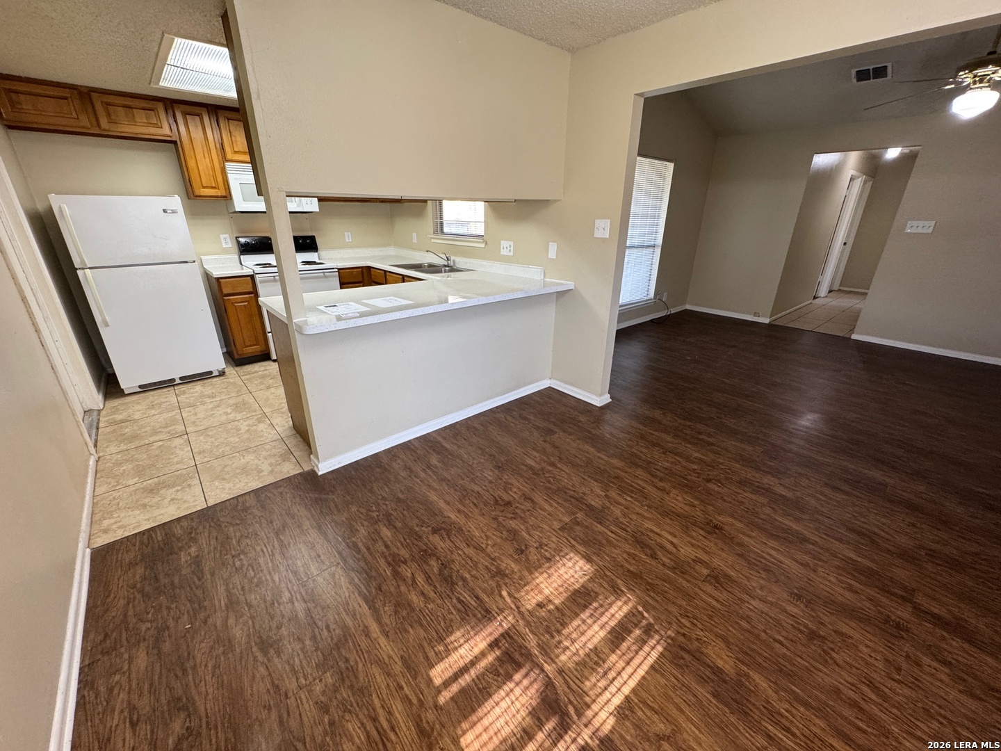 7236 Rimwood Street San Antonio, TX 78233 - Photo 8 of 16 a kitchen with a sink and wooden floor