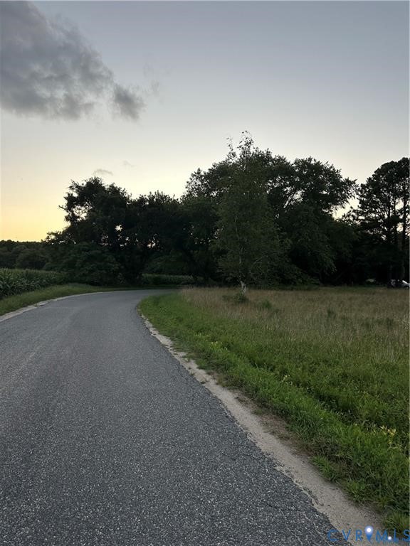 0 Providence Road Deltaville, VA 23043 - Photo 9 of 15 a view of a field with trees in background