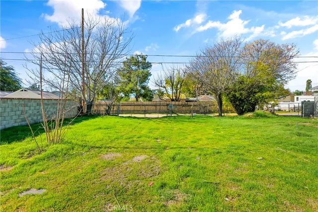 a backyard of a house with lots of green space
