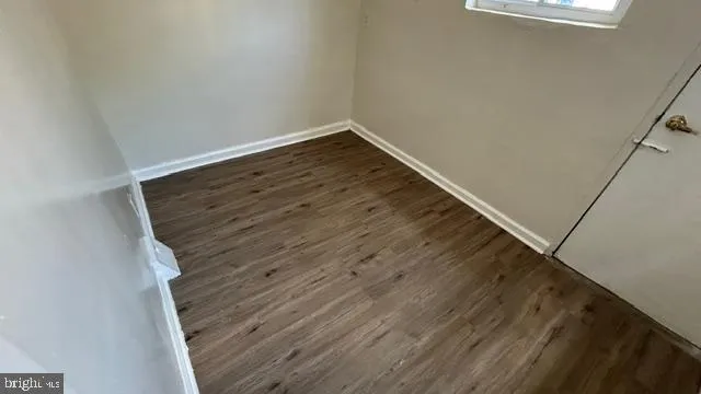 a view of wooden floor in an empty room