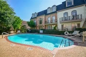 a kitchen with stainless steel appliances granite countertop a refrigerator and a stove