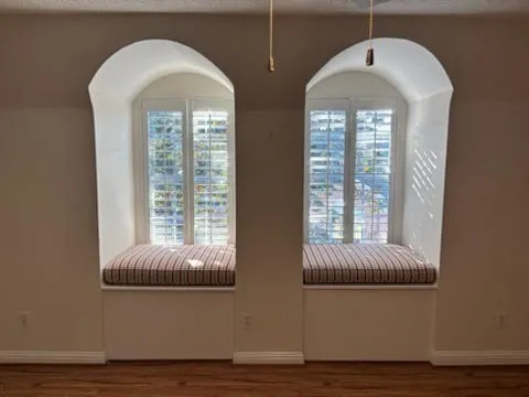 a view of walk in closet with empty racks