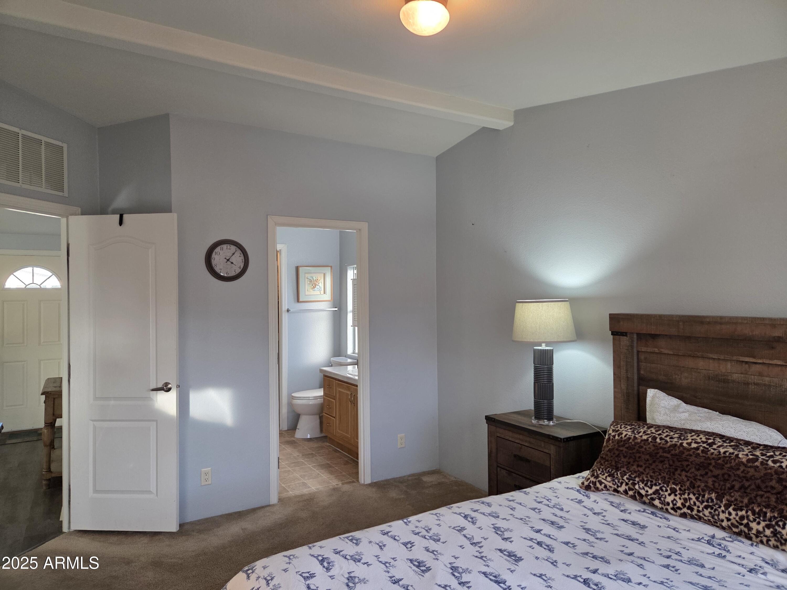 2929 East Main Street, Unit 107 Mesa, AZ 85213 - Photo 19 of 42 a bedroom with a bed and a lamp