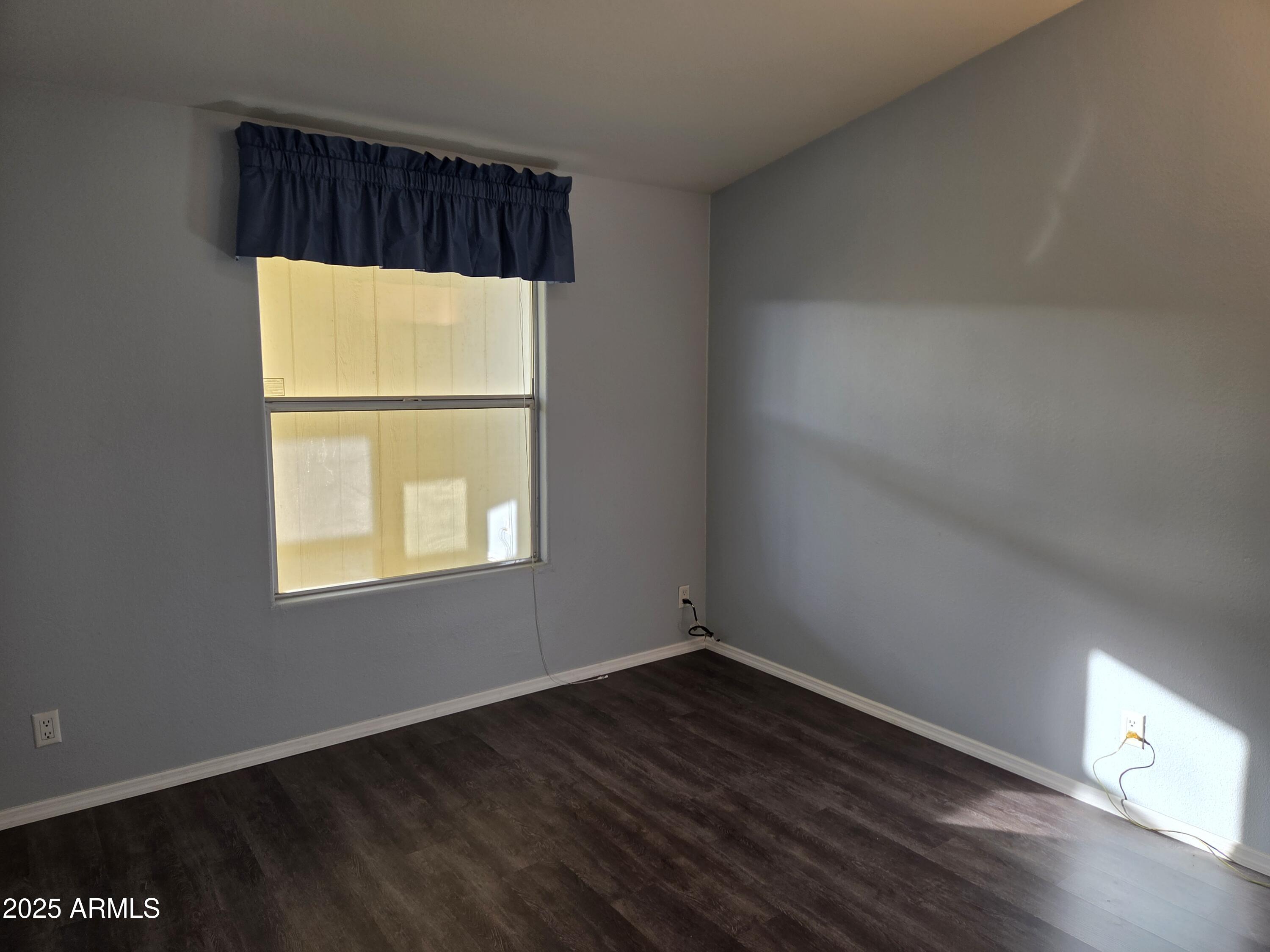 2929 East Main Street, Unit 107 Mesa, AZ 85213 - Photo 23 of 42 an empty room with a window