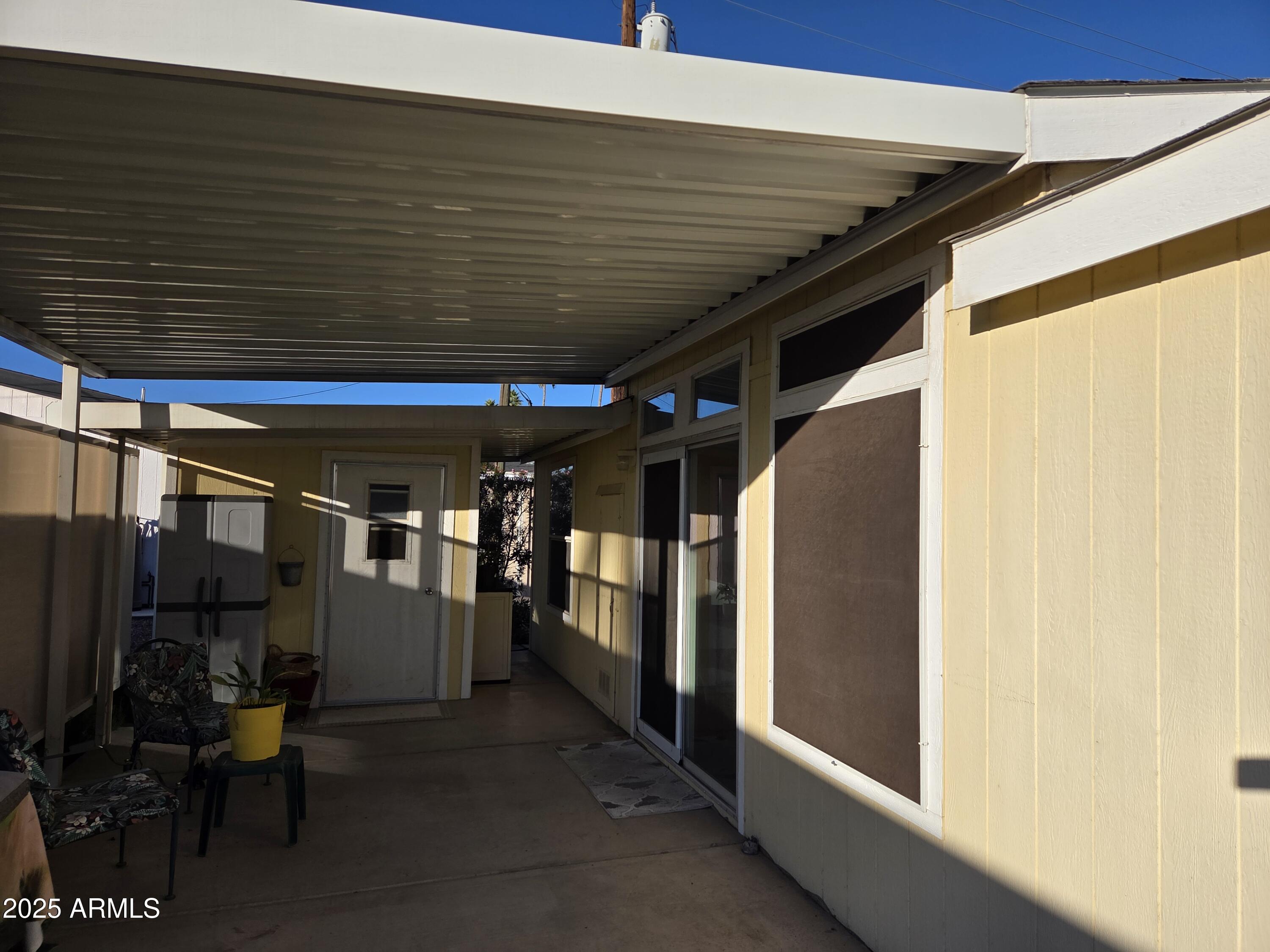 2929 East Main Street, Unit 107 Mesa, AZ 85213 - Photo 30 of 42 a view of a hallway with the view of the house