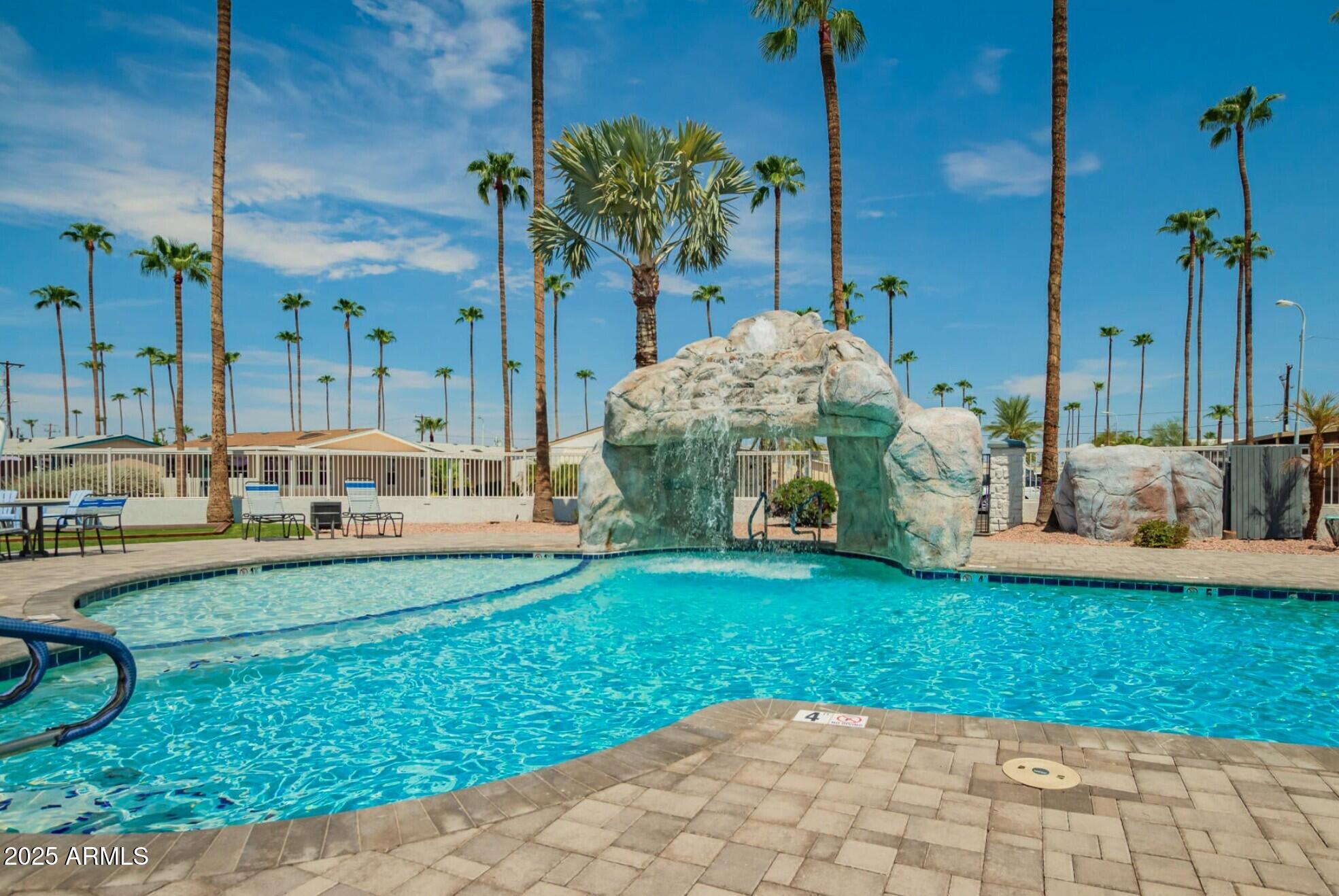 2929 East Main Street, Unit 107 Mesa, AZ 85213 - Photo 38 of 42 a view of a house with a swimming pool