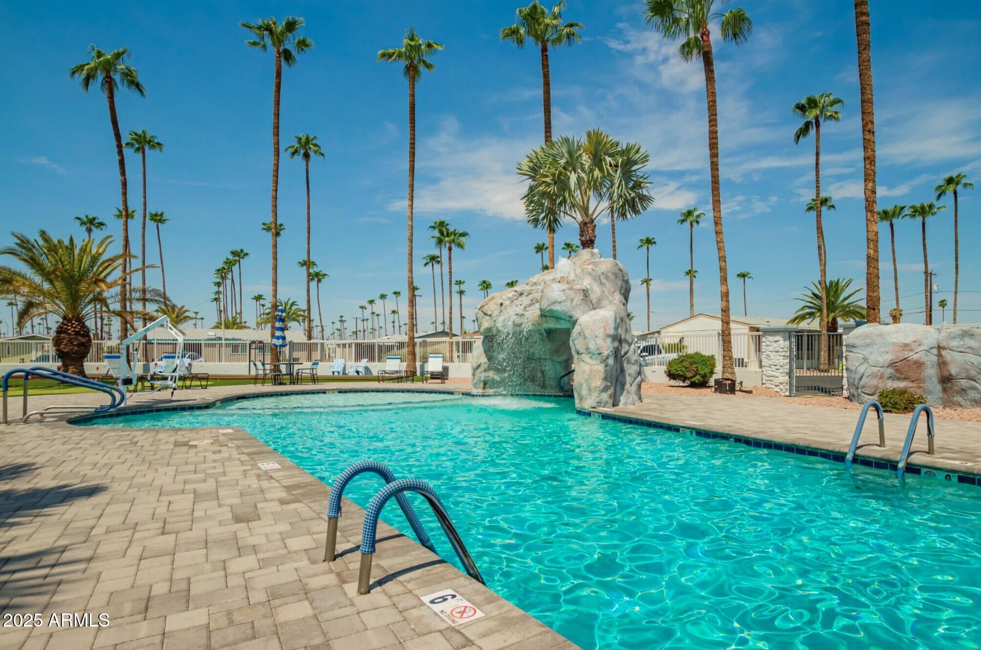 2929 East Main Street, Unit 107 Mesa, AZ 85213 - Photo 39 of 42 a swimming pool with outdoor seating and yard