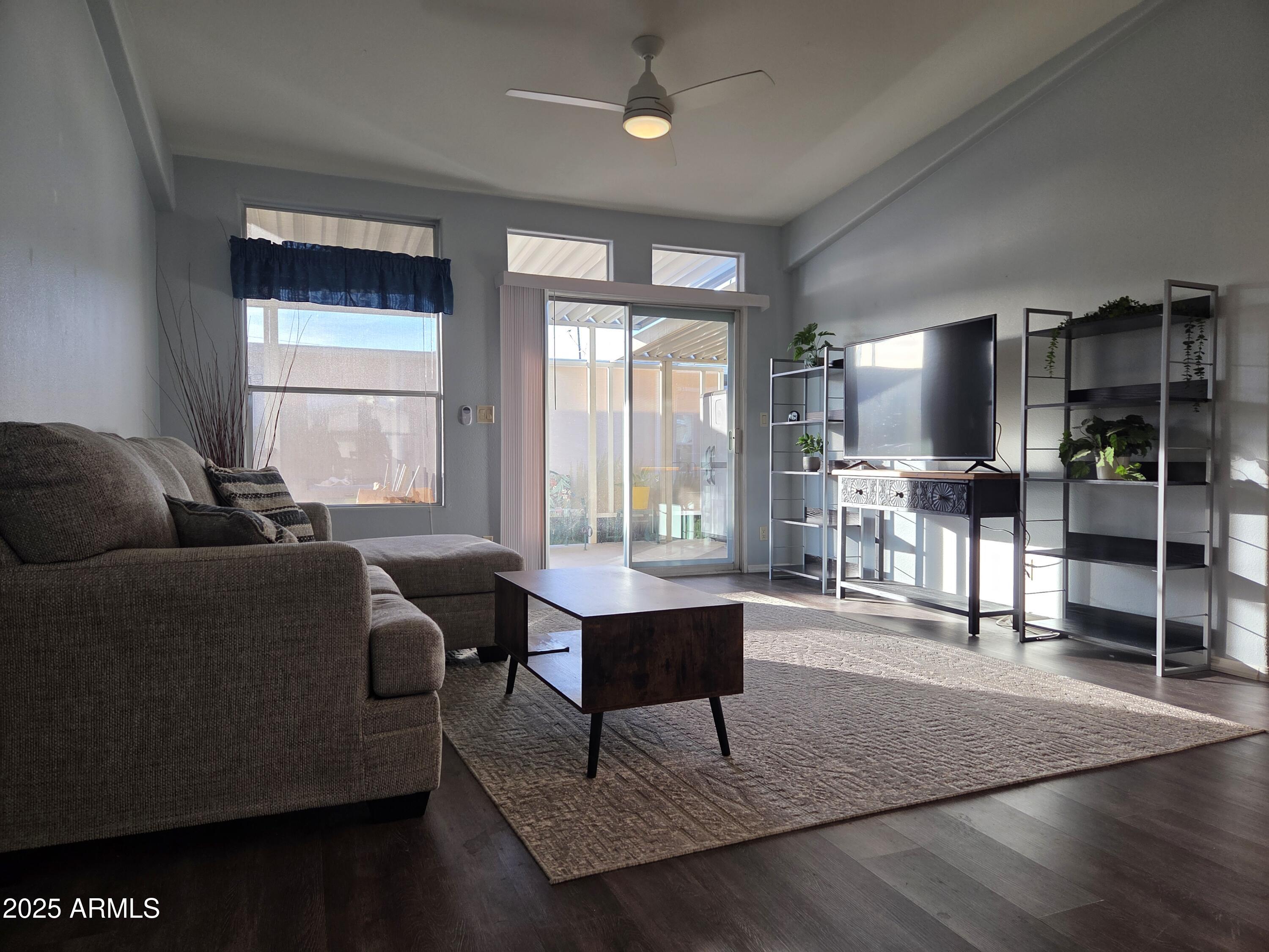 2929 East Main Street, Unit 107 Mesa, AZ 85213 - Photo 4 of 42 a living room with furniture and a window