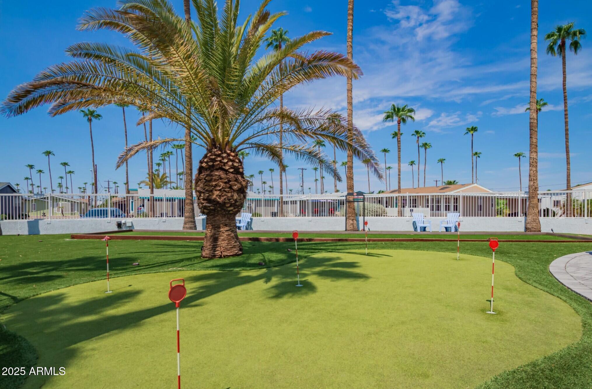 2929 East Main Street, Unit 107 Mesa, AZ 85213 - Photo 41 of 42 a swimming pool with outdoor seating and yard