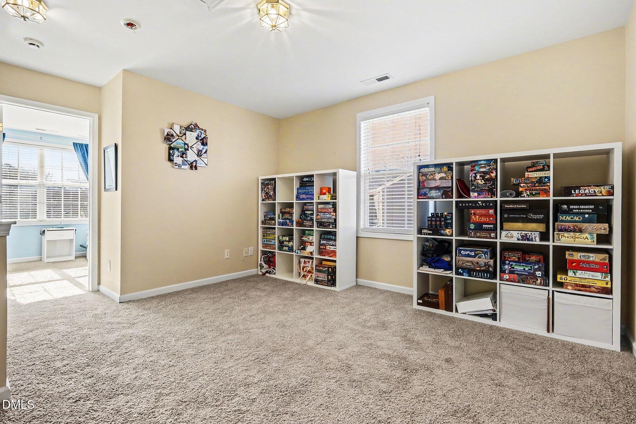 100 Rocca Circle Raleigh, NC 27603 - Photo 15 of 27 an empty room with bookshelf and a window
