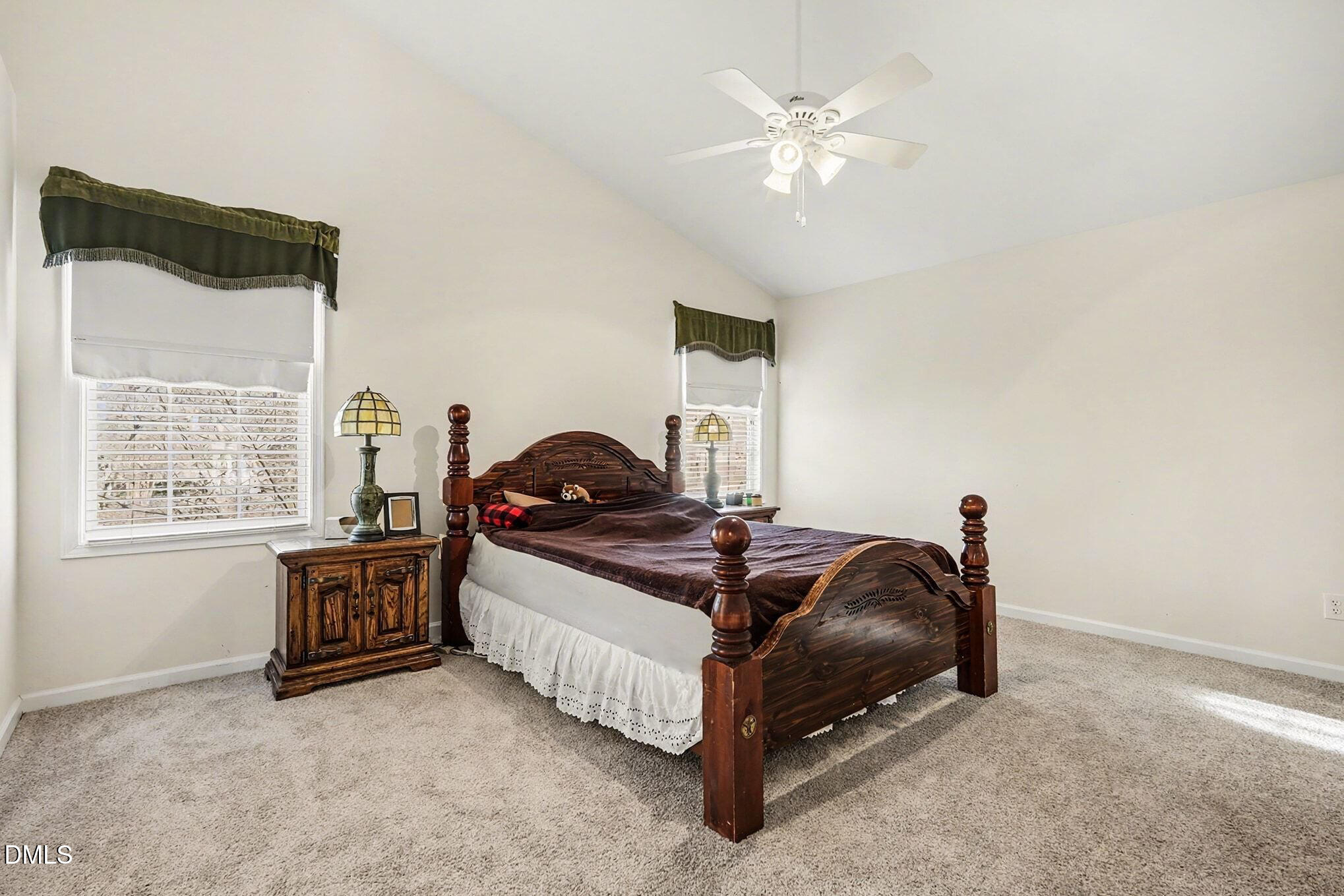 100 Rocca Circle Raleigh, NC 27603 - Photo 17 of 27 a bed room with a bed and a chandelier