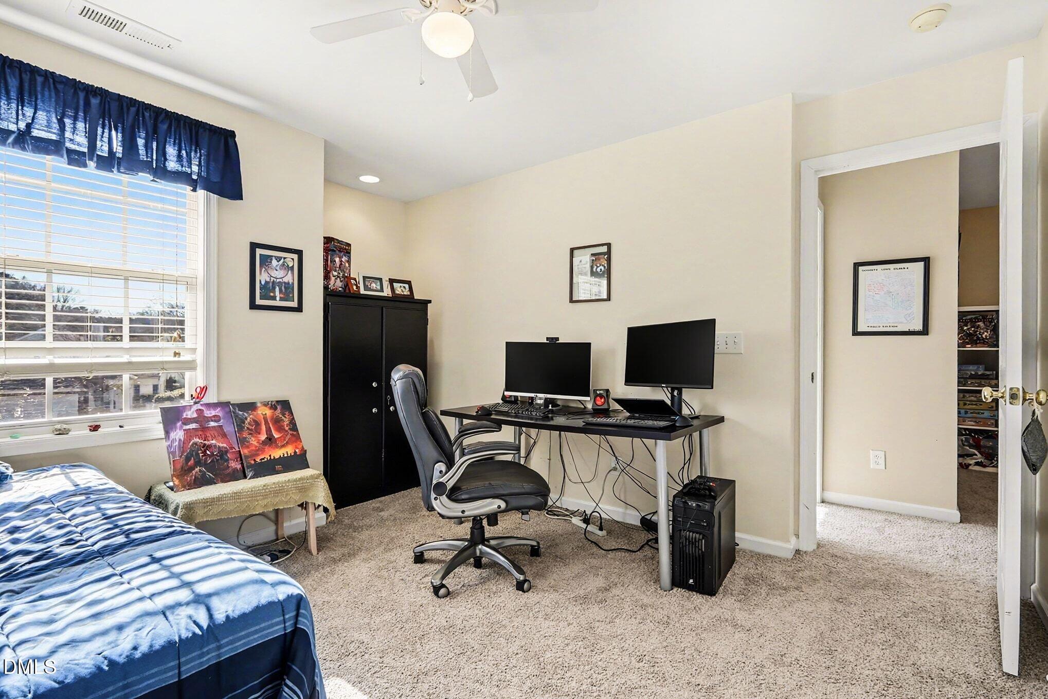 100 Rocca Circle Raleigh, NC 27603 - Photo 22 of 27 a bedroom with a workspace