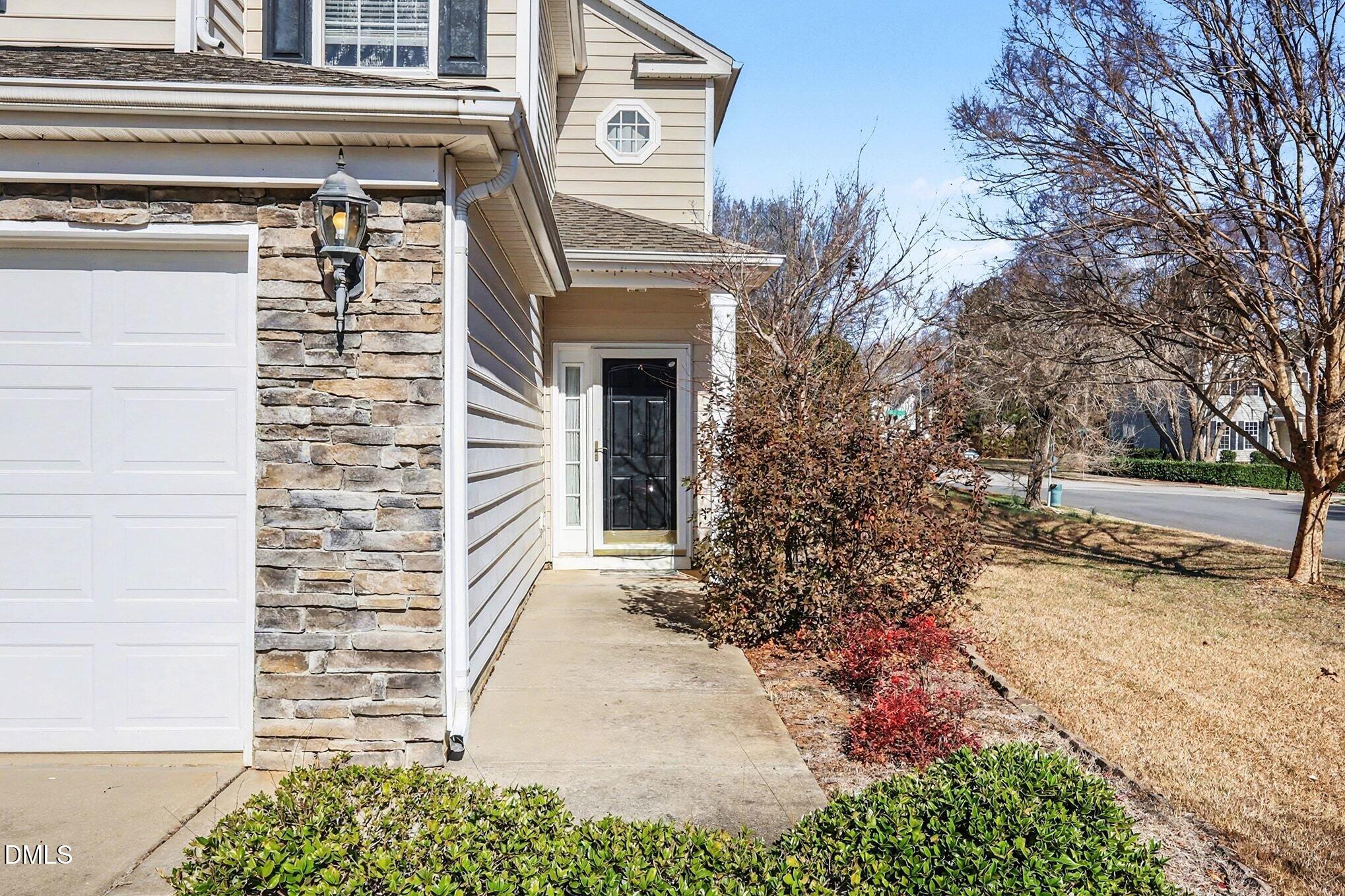 100 Rocca Circle Raleigh, NC 27603 - Photo 4 of 27 a view of a pathway of a house with a yard