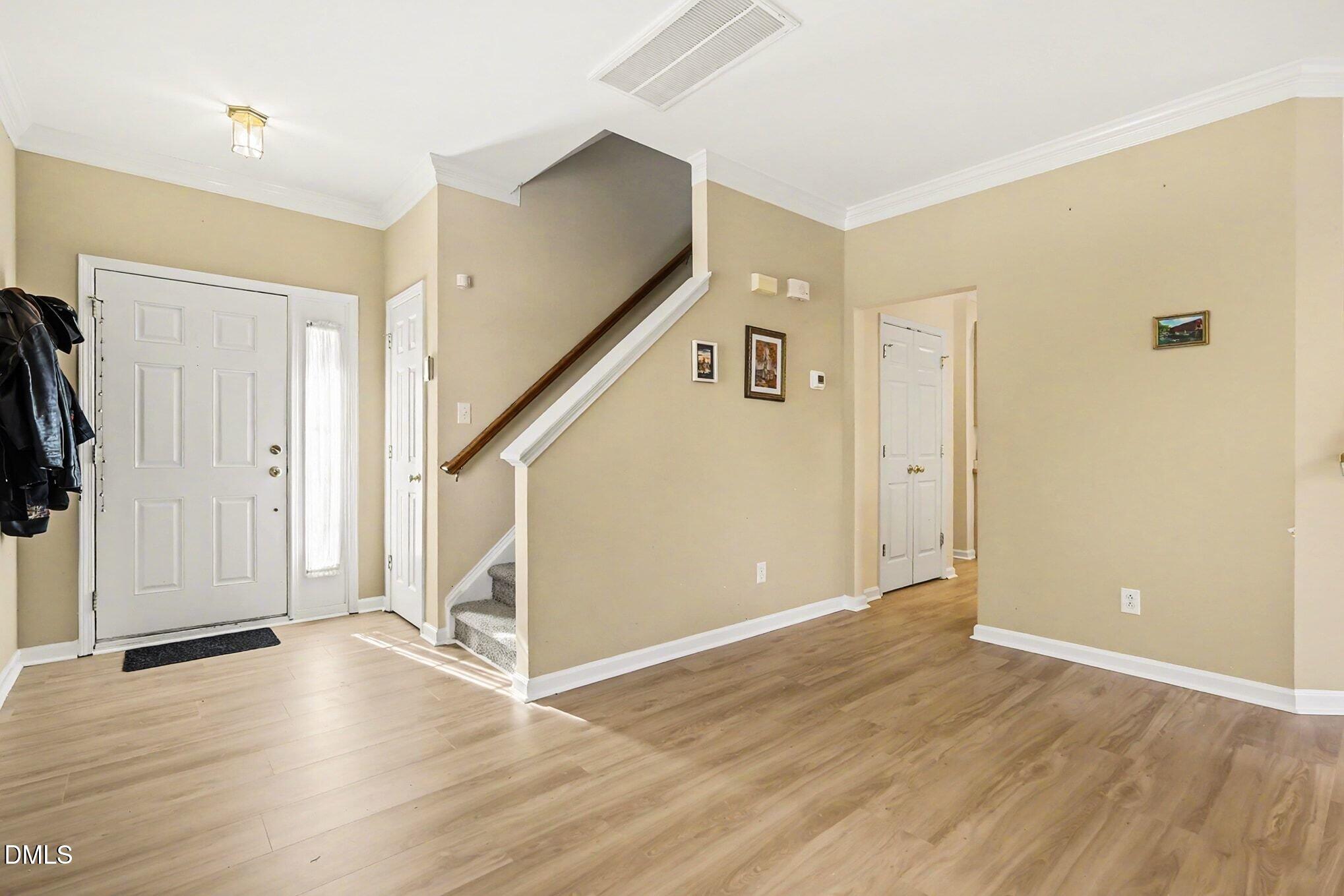 100 Rocca Circle Raleigh, NC 27603 - Photo 5 of 27 a view of entryway with wooden floor