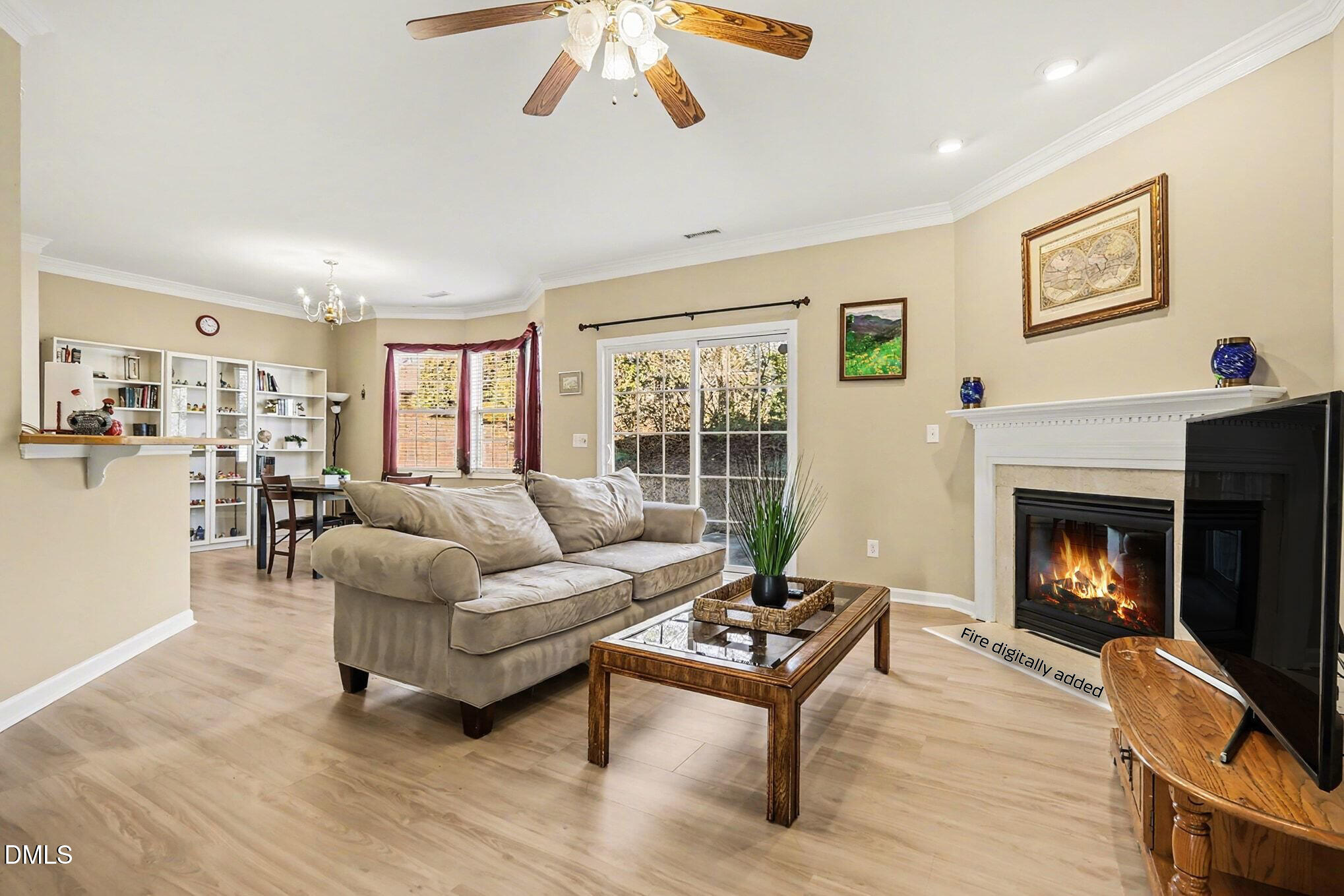100 Rocca Circle Raleigh, NC 27603 - Photo 7 of 27 a living room with furniture and a fireplace