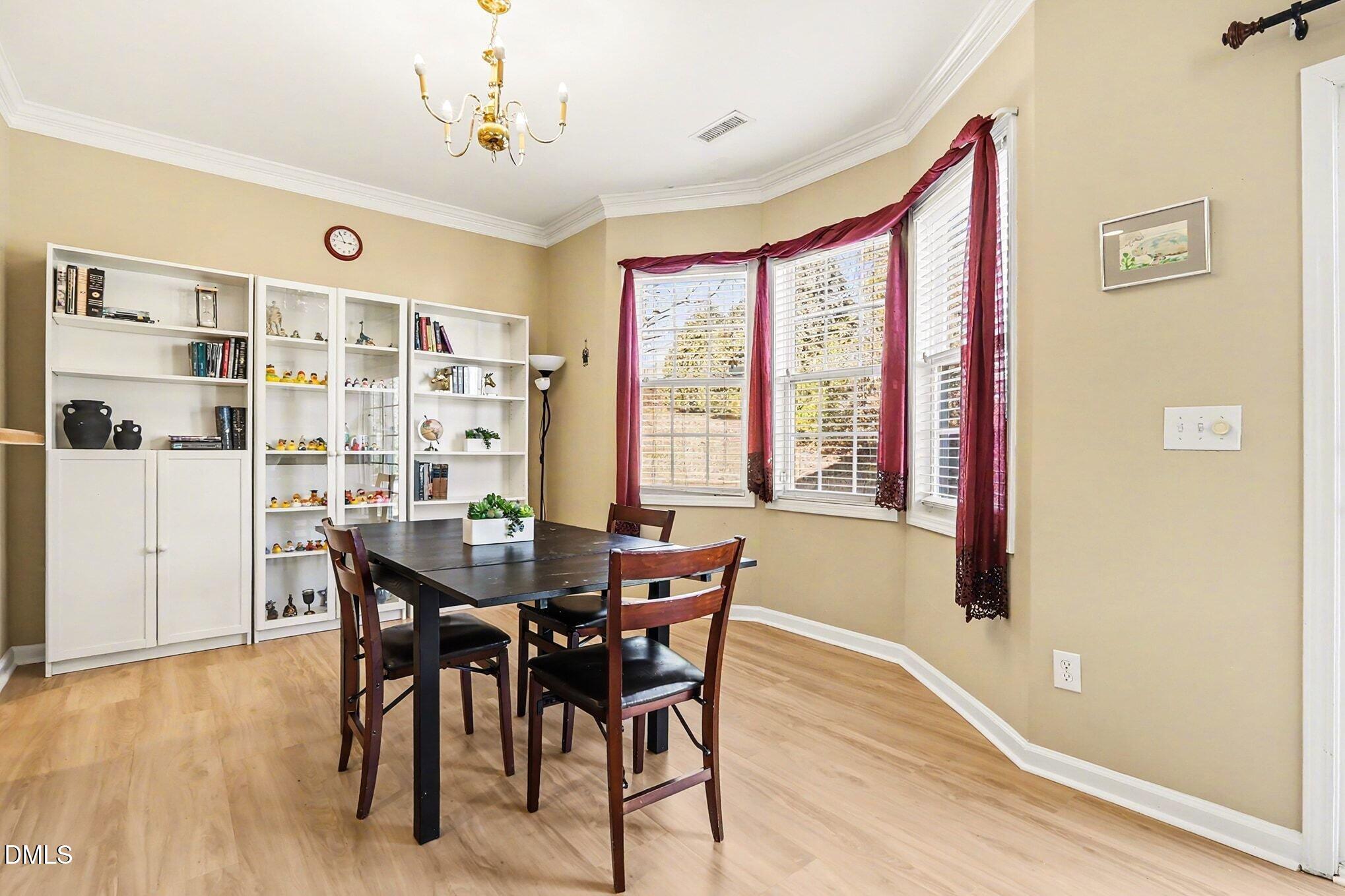 100 Rocca Circle Raleigh, NC 27603 - Photo 8 of 27 a view of a dining room with furniture and window