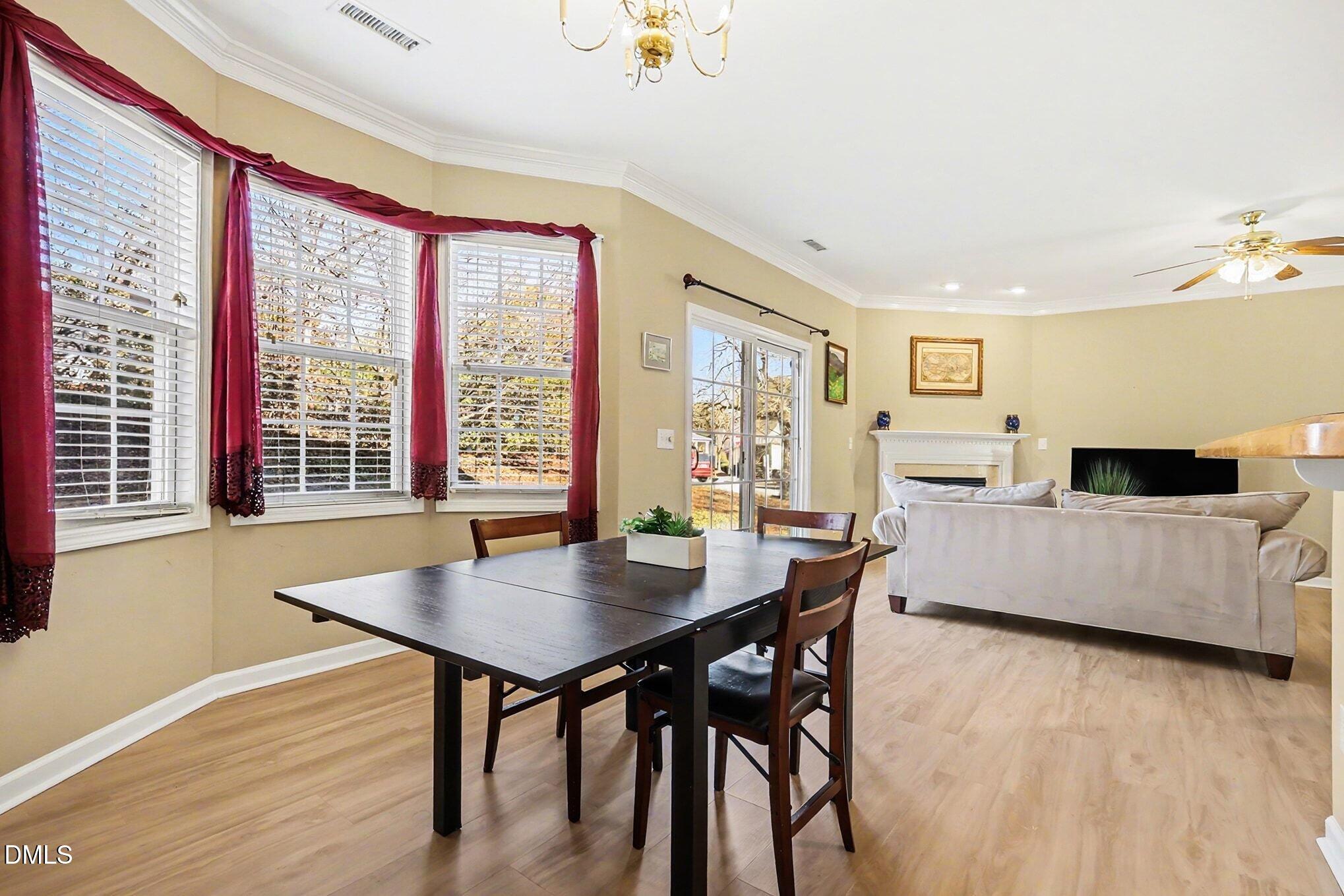 100 Rocca Circle Raleigh, NC 27603 - Photo 9 of 27 a living room with furniture and a large window