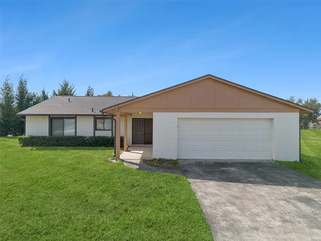 a front view of a house with yard