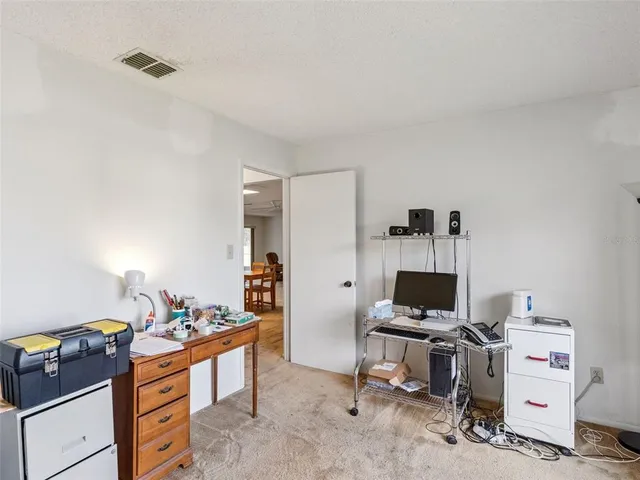 a view of room with furniture and windows
