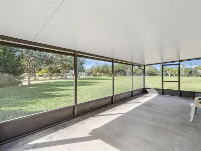 a view of a house with a yard and a porch