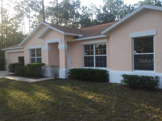 9 Raeland Lane Palm Coast, FL 32164 - Photo 1 of 1 a view of a house with a yard