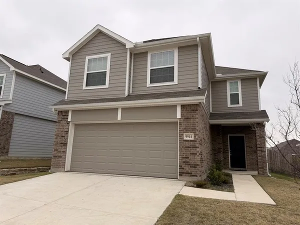 a front view of a house with yard