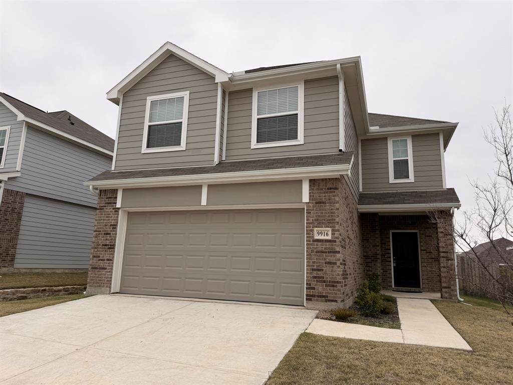 a front view of a house with yard