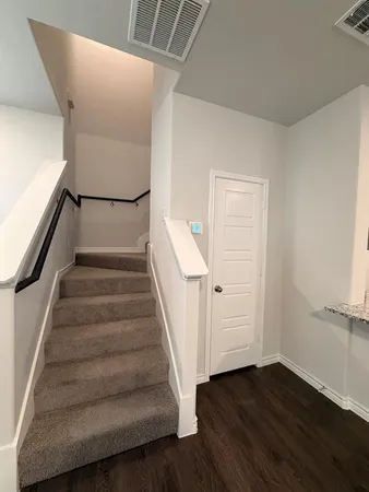 a view of entryway with wooden floor