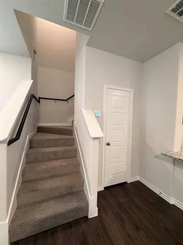 a view of entryway with wooden floor