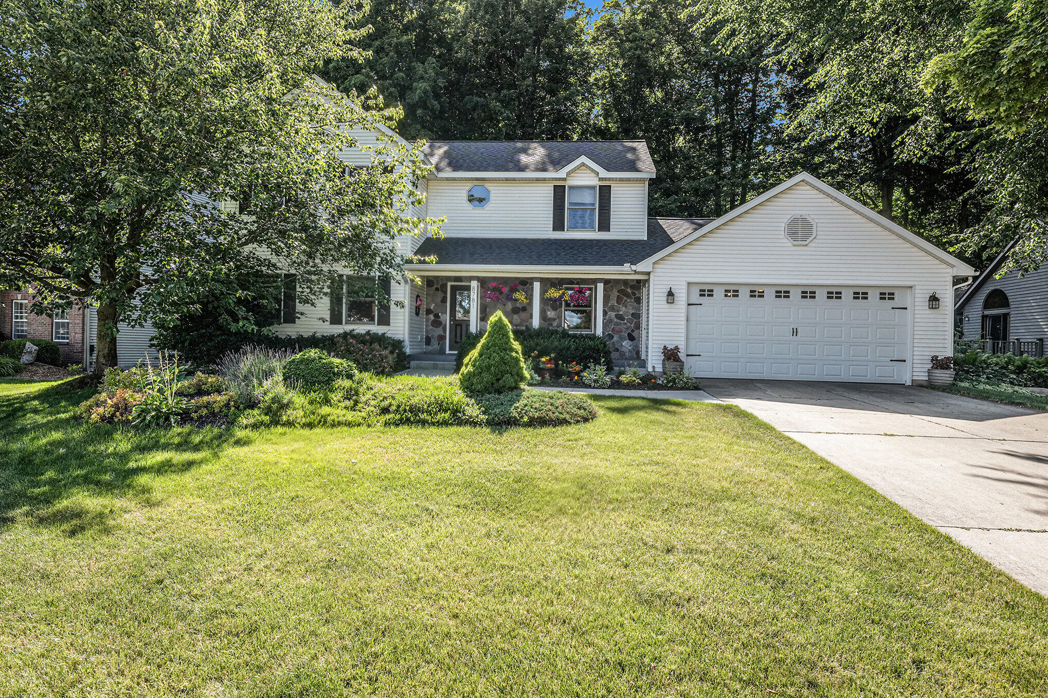 8781 Conifer Ridge Drive Southwest Byron Center, MI 49315 - Photo 4 of 53 Front Exterior