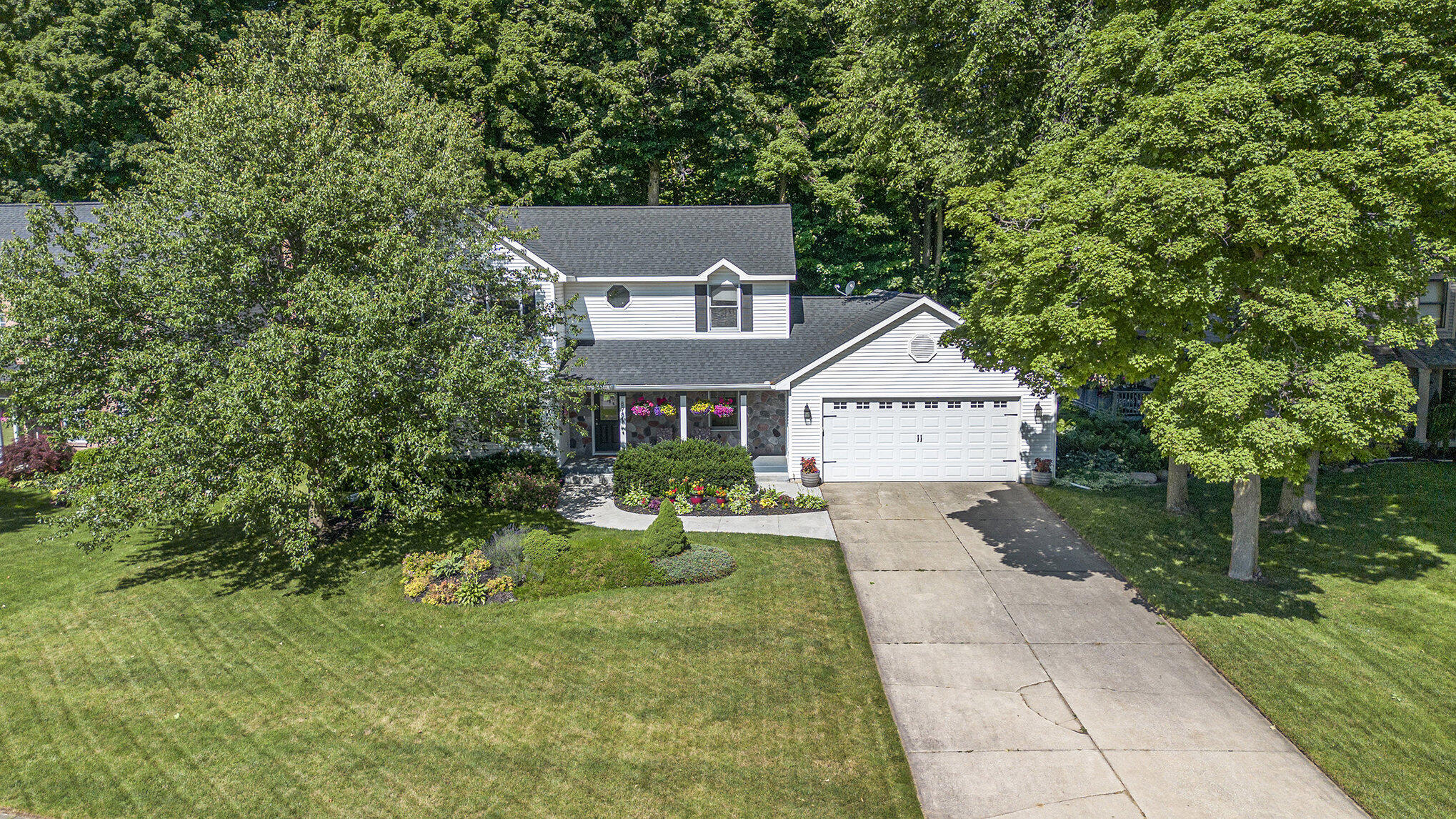 8781 Conifer Ridge Drive Southwest Byron Center, MI 49315 - Photo 49 of 53 Large front yard