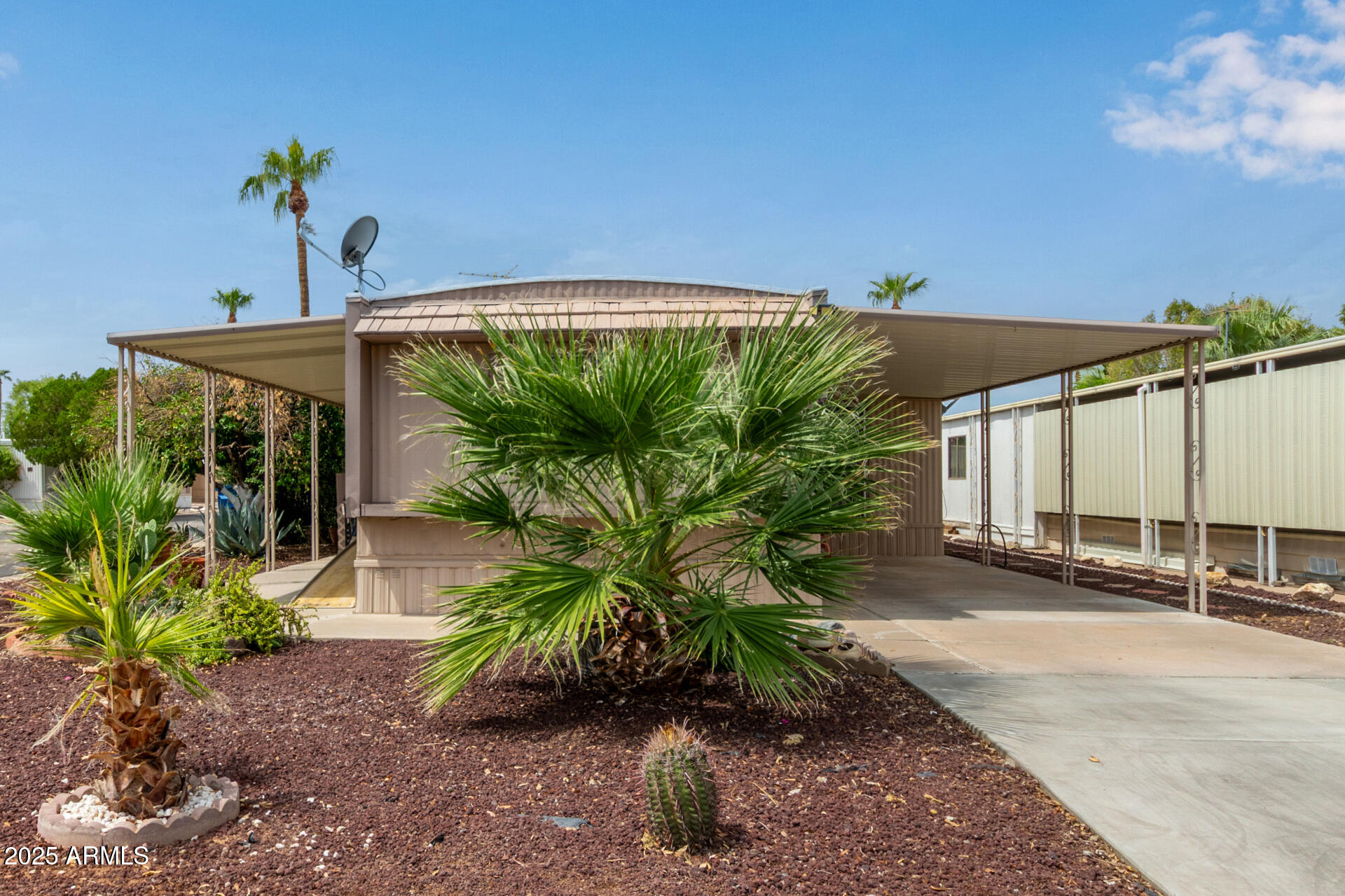 a couple of potted plants in front of a building