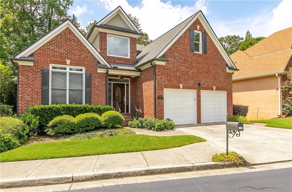 1551 Reserve Circle Decatur, GA 30033 - Photo 1 of 1 a front view of a house with a yard and garage
