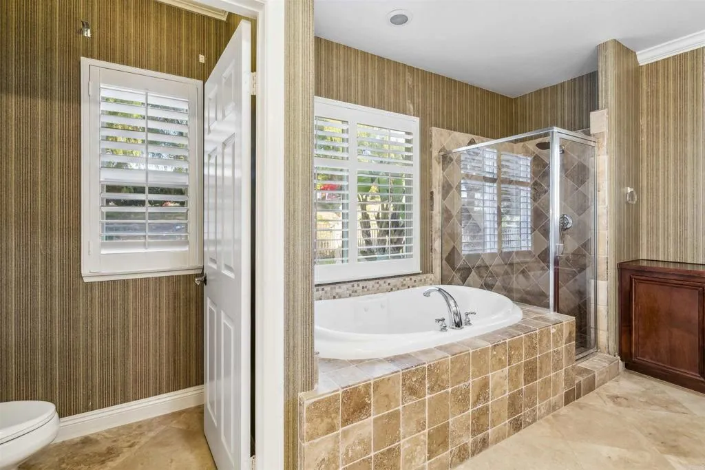 13371 Sage Meadow Lane, Unit 1 Valley Center, CA 92082 - Photo 31 of 38 a en suite bathroom with a bathtub and next to a window