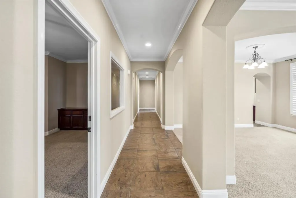 13371 Sage Meadow Lane, Unit 1 Valley Center, CA 92082 - Photo 8 of 38 a view of a hallway with wooden floor and a living room