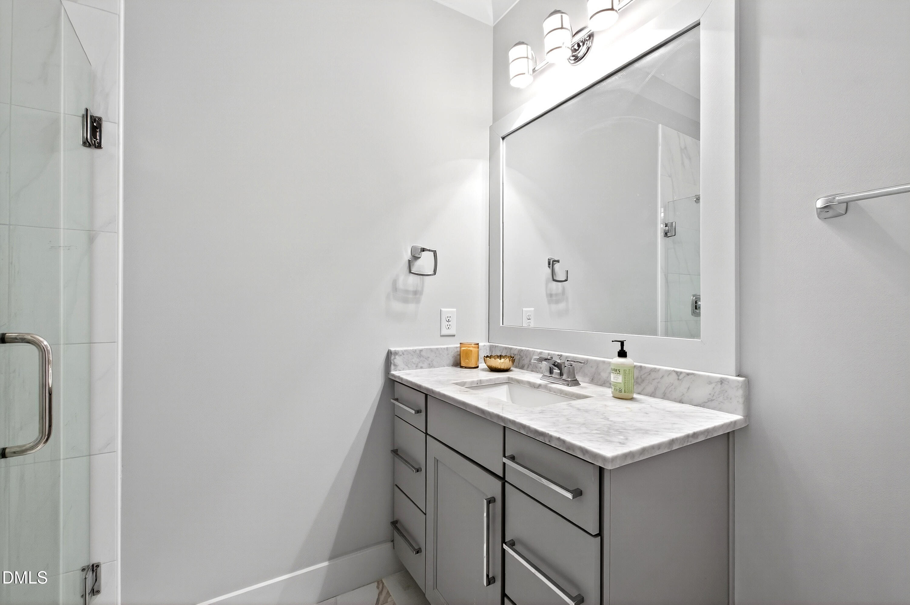 1116 Hymettus Court Raleigh, NC 27607 - Photo 39 of 69 a bathroom with a sink and mirror