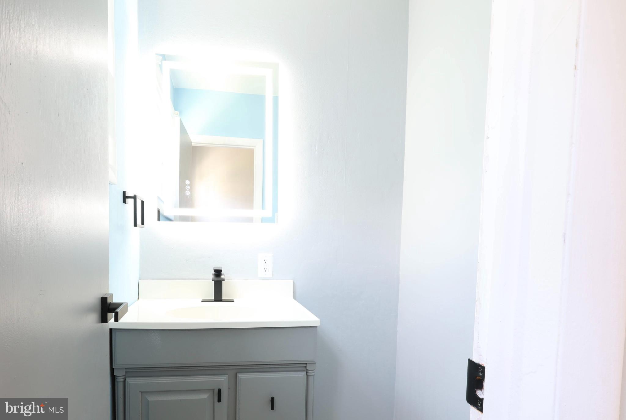 22 Clemson Road Cherry Hill, NJ 08034 - Photo 12 of 25 a bathroom with a sink and a mirror