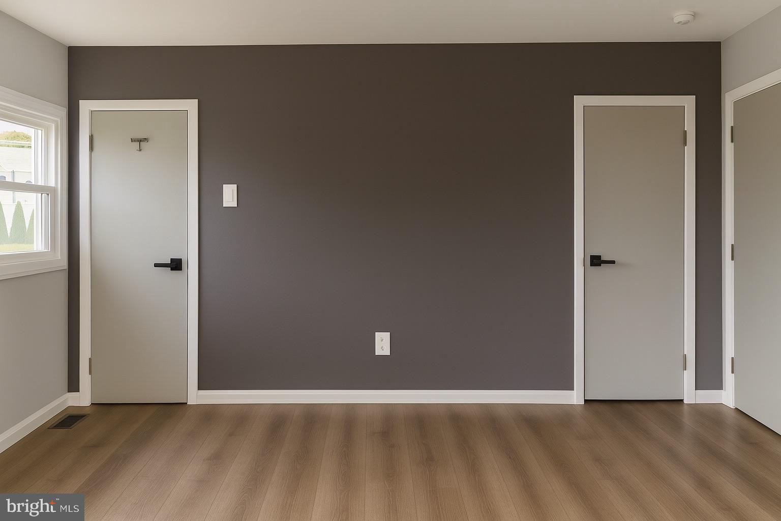 22 Clemson Road Cherry Hill, NJ 08034 - Photo 20 of 25 an empty room with wooden floor and windows