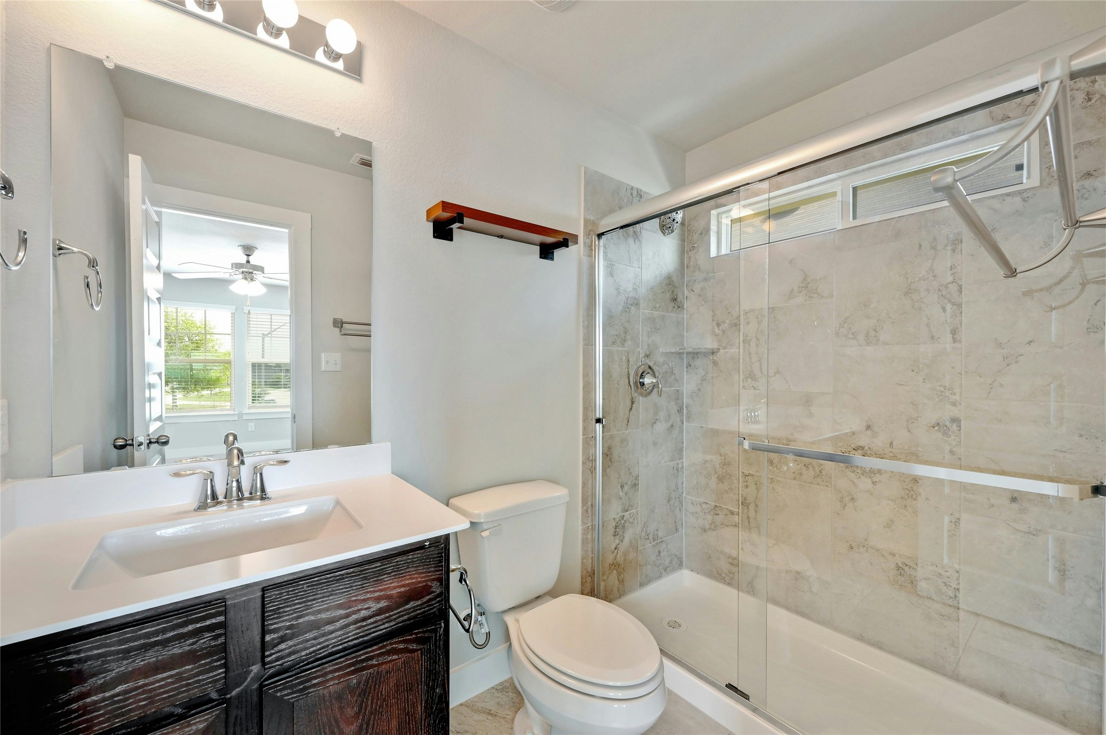 121 Switchgrass Street San Marcos, TX 78666 - Photo 23 of 33 Primary bathroom with frameless glass shower door.