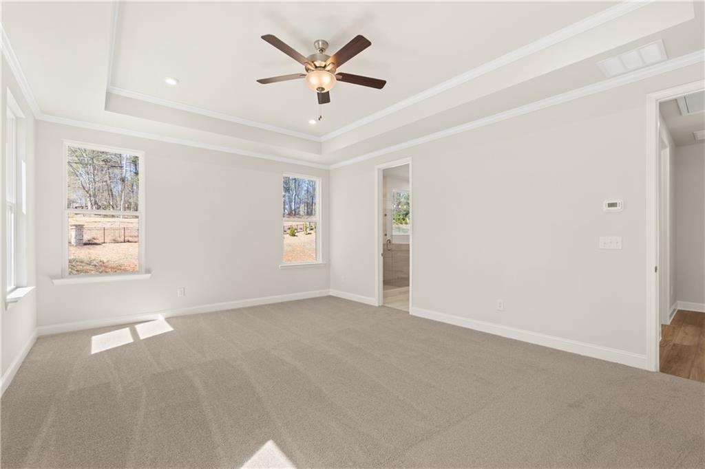 900 Melody Ridge Lane Buford, GA 30518 - Photo 20 of 30 an empty room with windows and fan