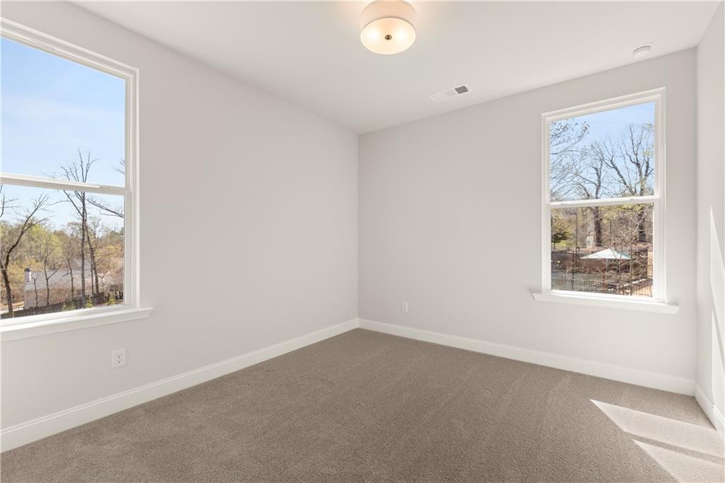 900 Melody Ridge Lane Buford, GA 30518 - Photo 27 of 30 an empty room with a window