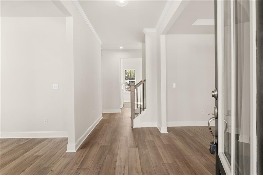 900 Melody Ridge Lane Buford, GA 30518 - Photo 5 of 30 a view of hallway with wooden floor